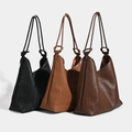 The styles in the store are the same - fashionable hand-woven leather bags.